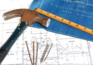 alt="Ruler, hammer, nails and plans"