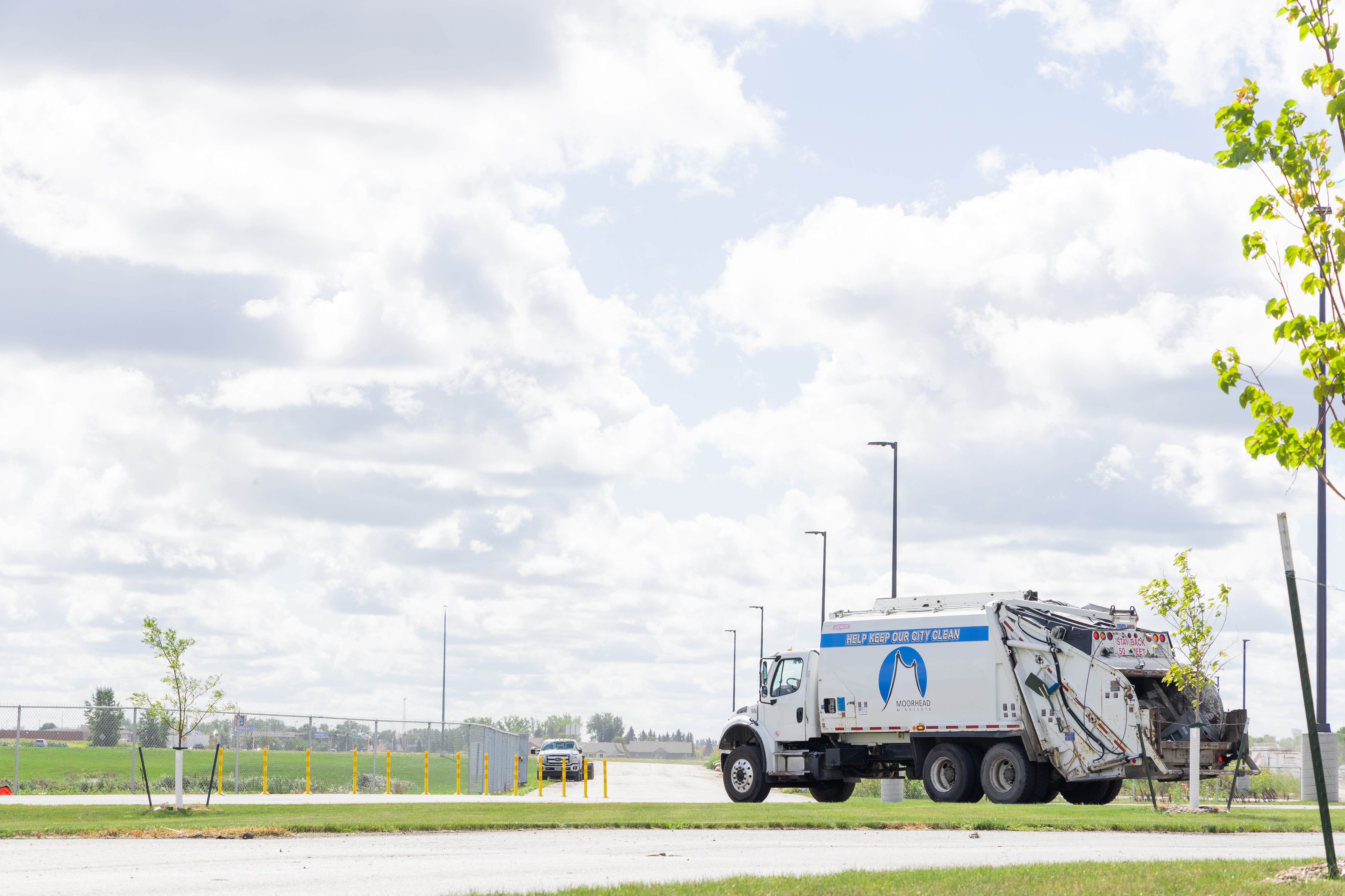 A Moorhead Sanitation Truck at a park