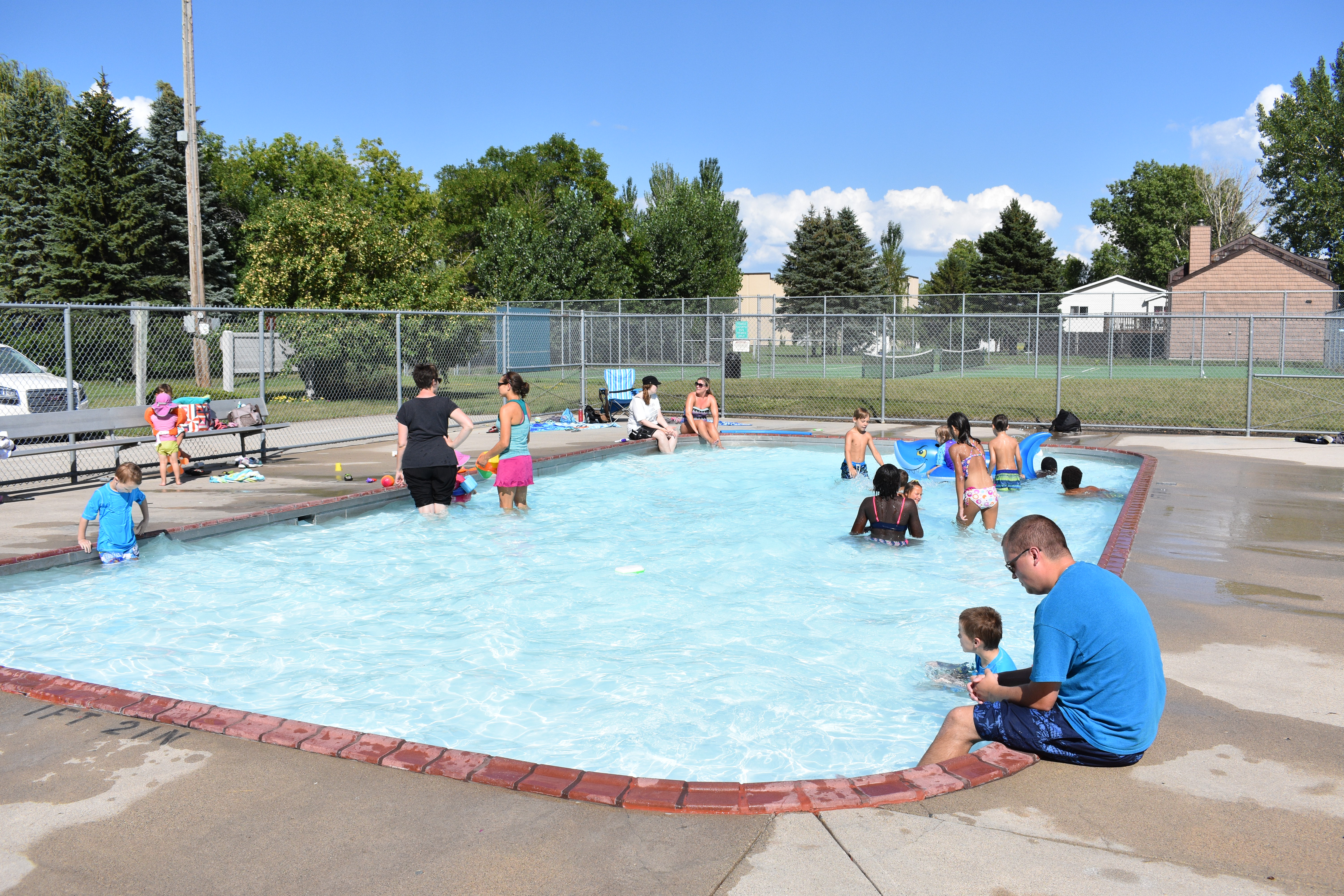 A photo of kids playing in a wading pool